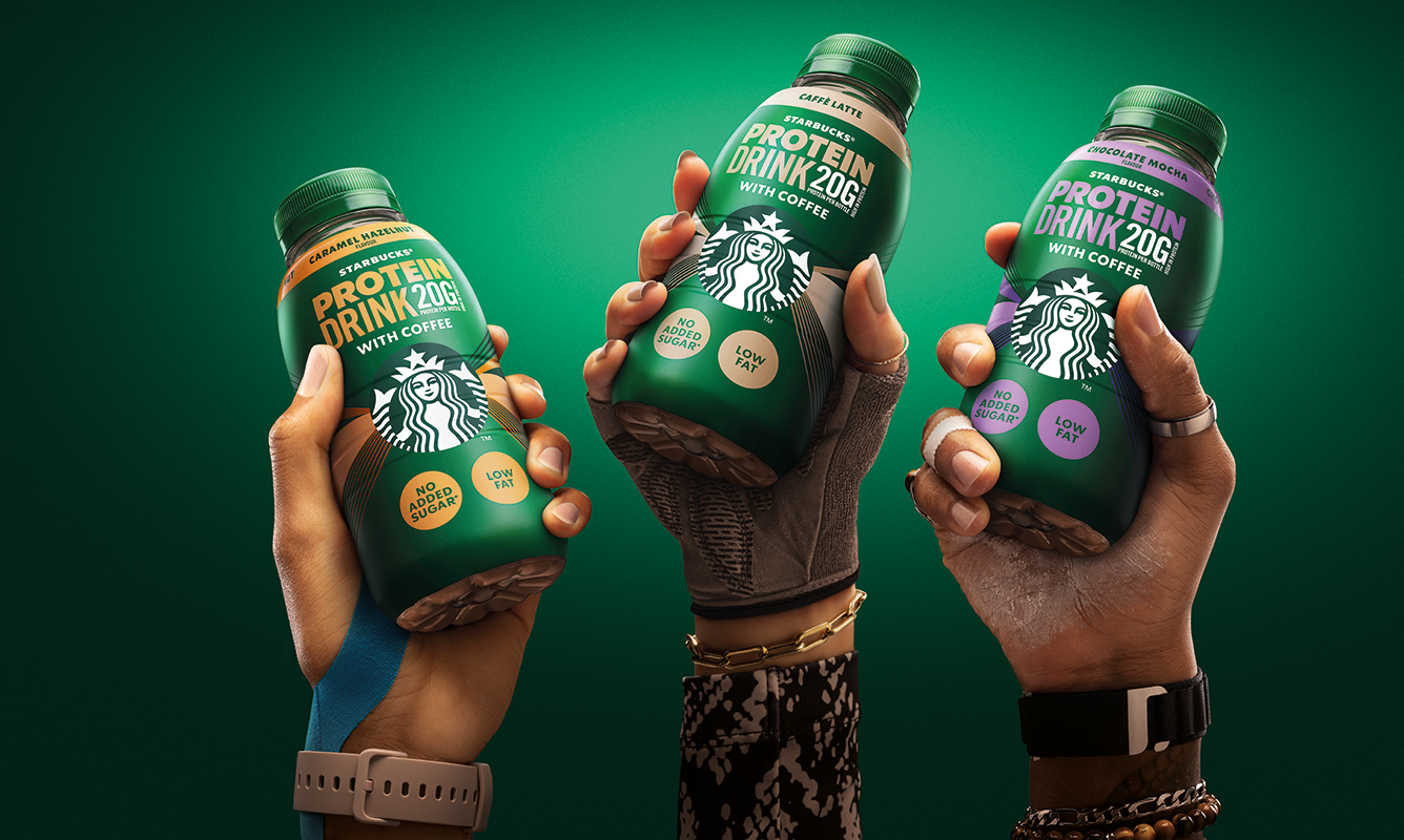 Hands holding Starbucks protein
